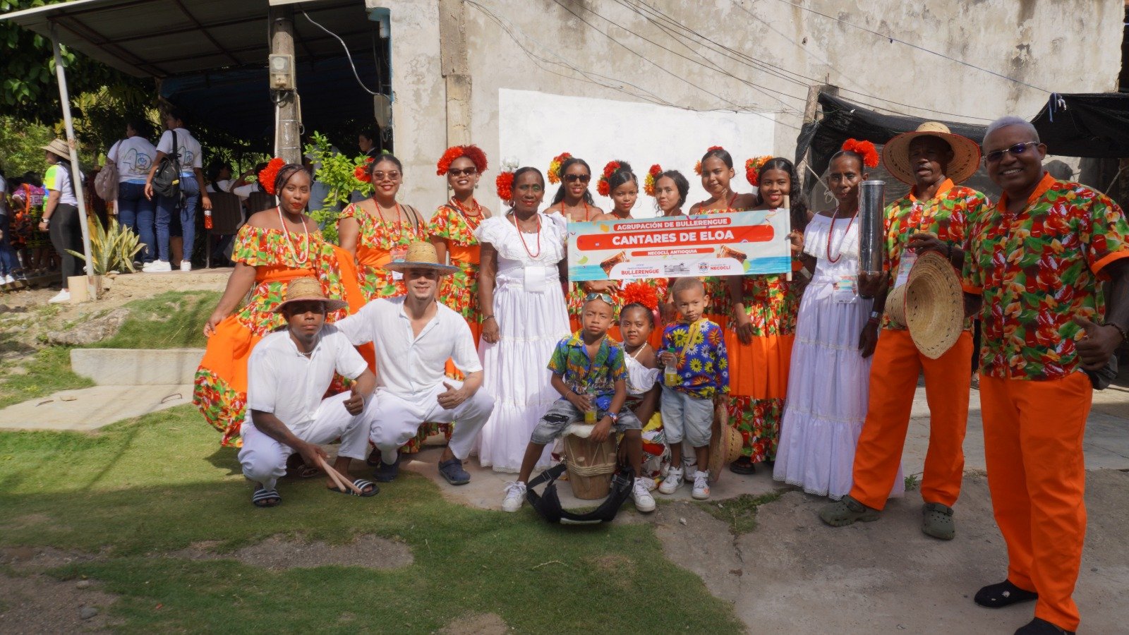 A bright pink sheet of paper used to wrap flowers curves in front of rich blue background